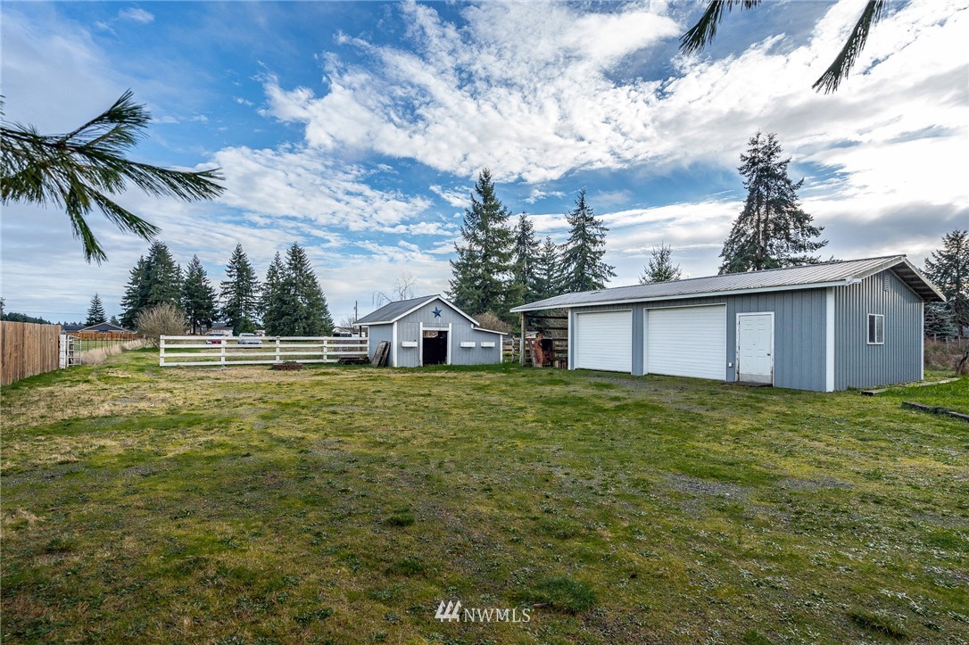 18036 Daryl Lane Southwest Rochester, WA 98579 - Photo 3 of 40 a view of a house with a backyard