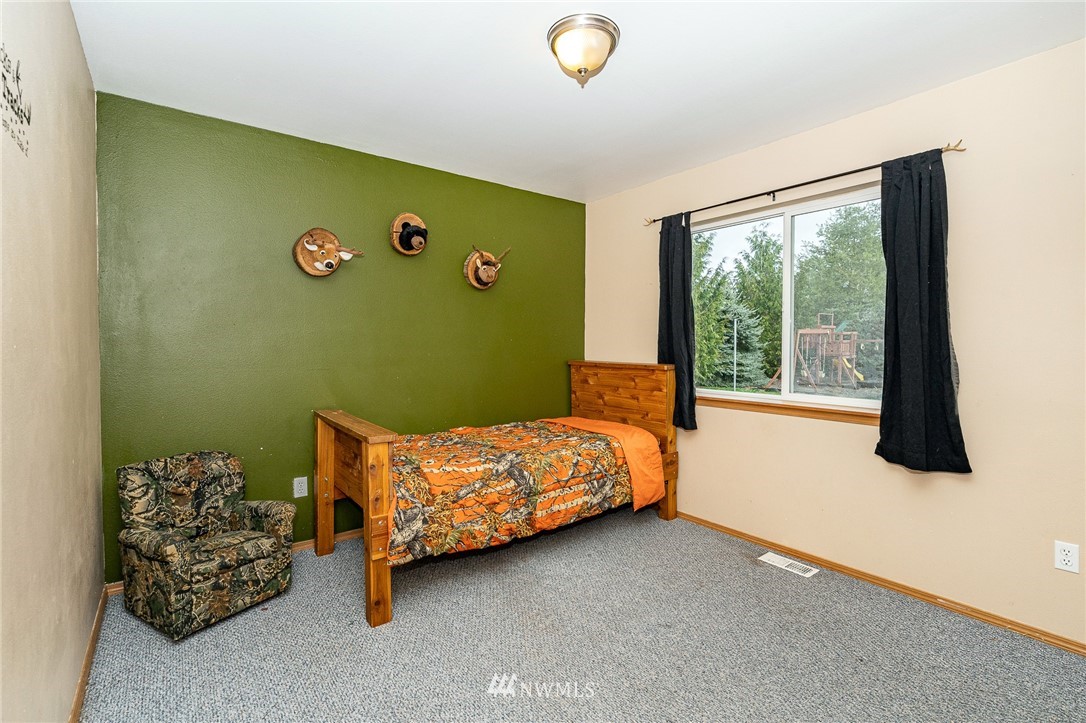 18036 Daryl Lane Southwest Rochester, WA 98579 - Photo 23 of 40 a bed room with a bed and a window