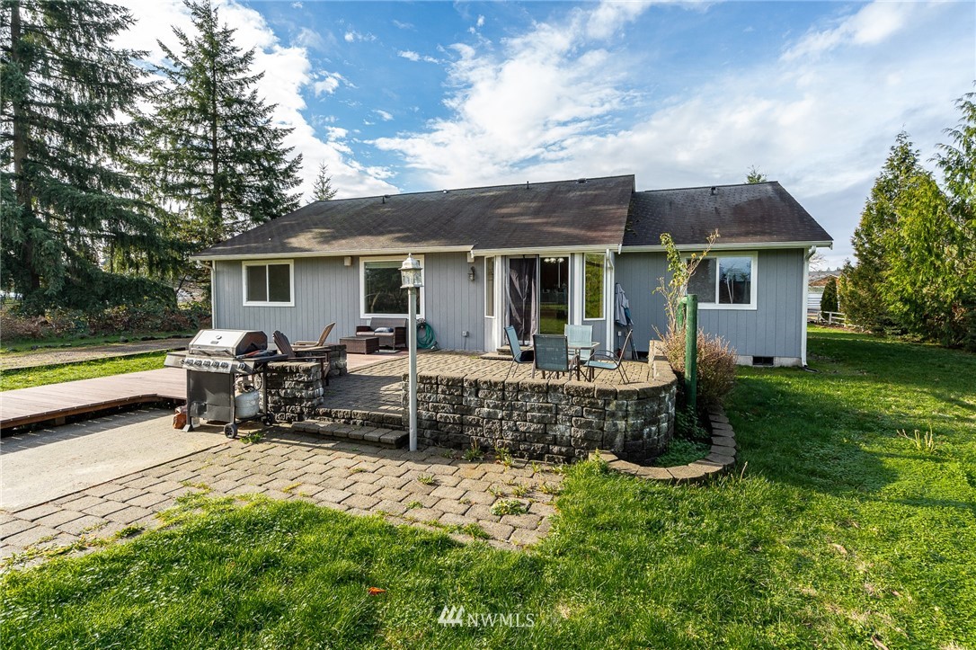 18036 Daryl Lane Southwest Rochester, WA 98579 - Photo 28 of 40 a view of house with backyard and outdoor seating