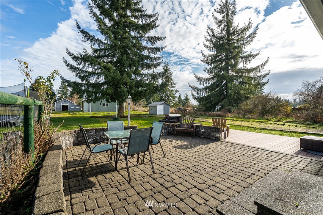 18036 Daryl Lane Southwest Rochester, WA 98579 - Photo 29 of 40 a swimming pool with lawn chairs and a yard