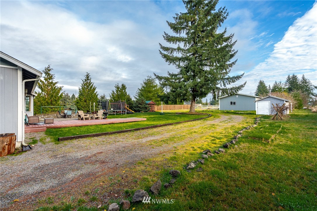 18036 Daryl Lane Southwest Rochester, WA 98579 - Photo 31 of 40 a view of yard with swimming pool and green space