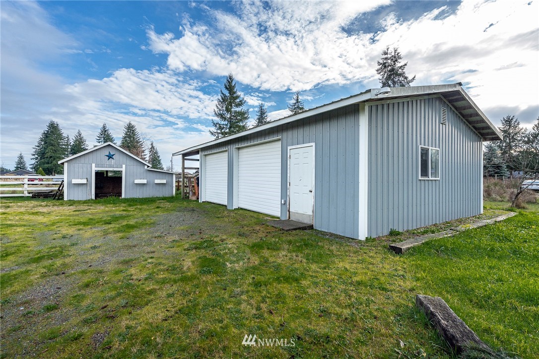 18036 Daryl Lane Southwest Rochester, WA 98579 - Photo 33 of 40 a house view with a backyard space