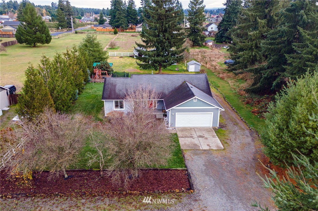 18036 Daryl Lane Southwest Rochester, WA 98579 - Photo 40 of 40 an aerial view of a house with a yard and large trees