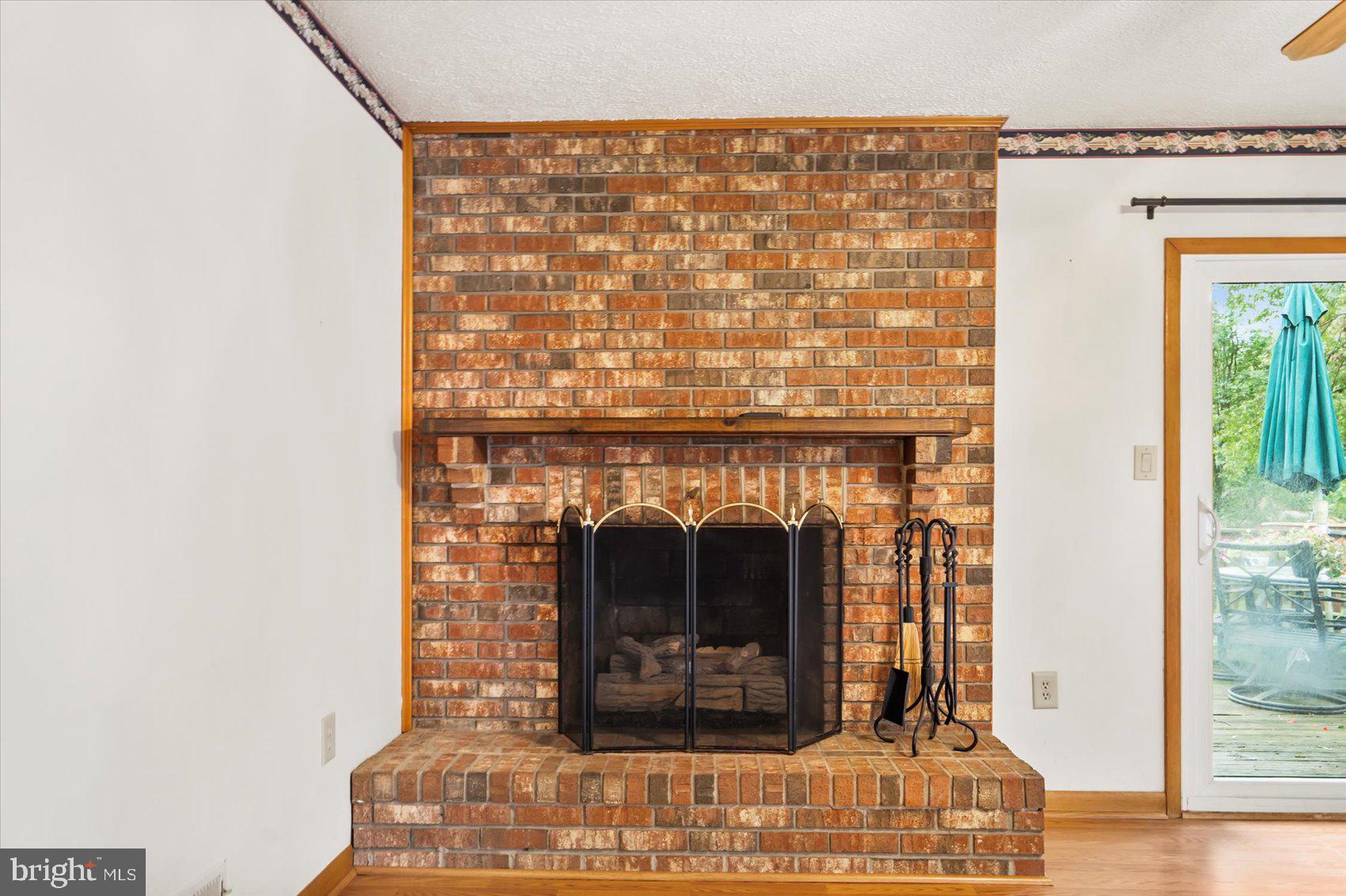 7909 Poplar Grove Road Severn, MD 21144 - Photo 12 of 39 Family room fireplace