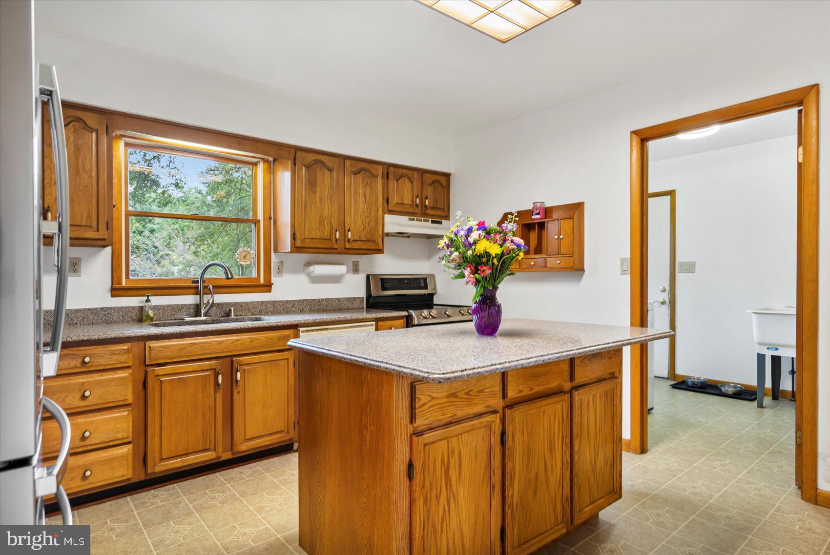 7909 Poplar Grove Road Severn, MD 21144 - Photo 25 of 39 Kitchen leading to mudroom and garage entrance