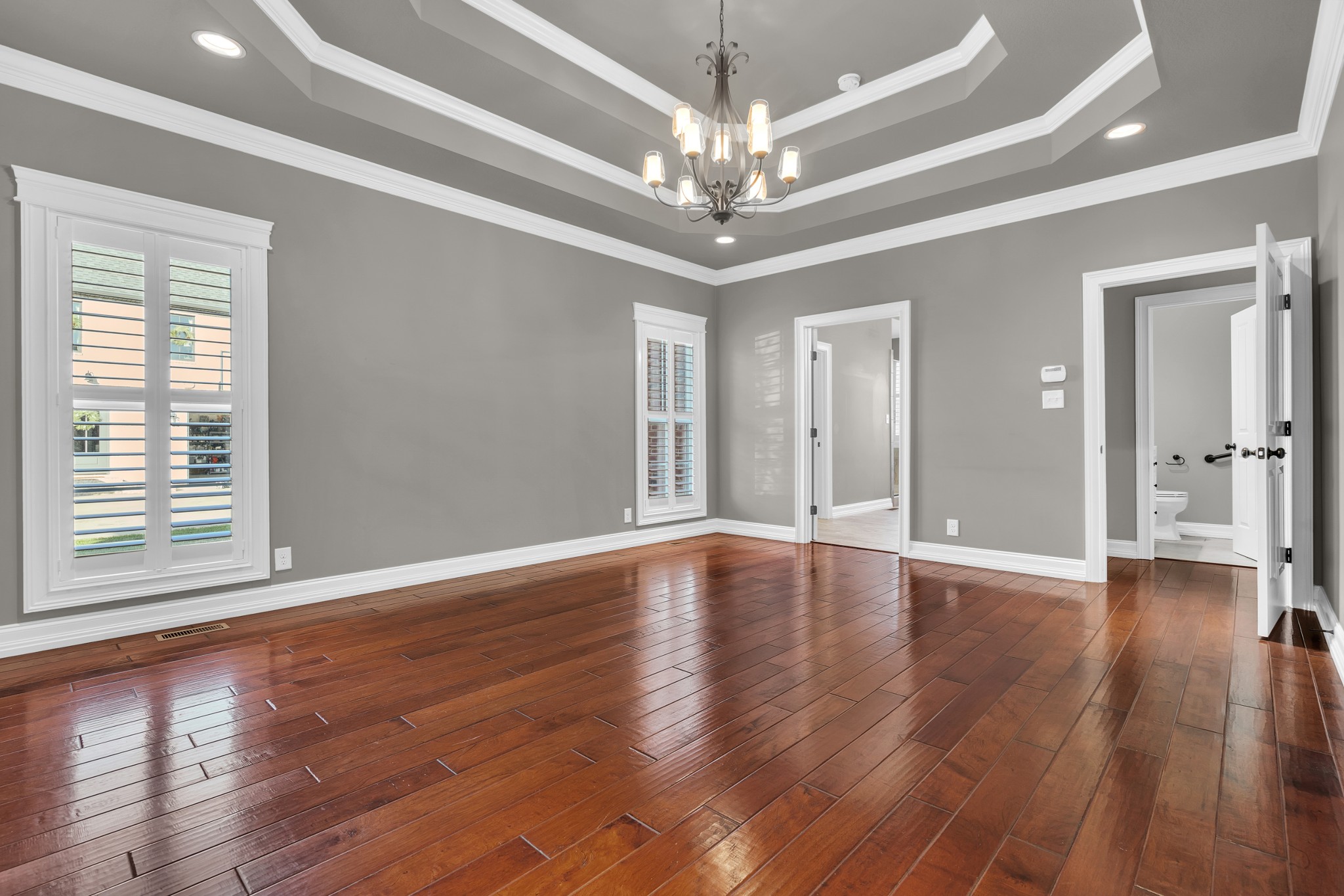 254 Gray Hawk Trail Clarksville, TN 37043 - Photo 14 of 29 a view of an empty room with wooden floor and a window