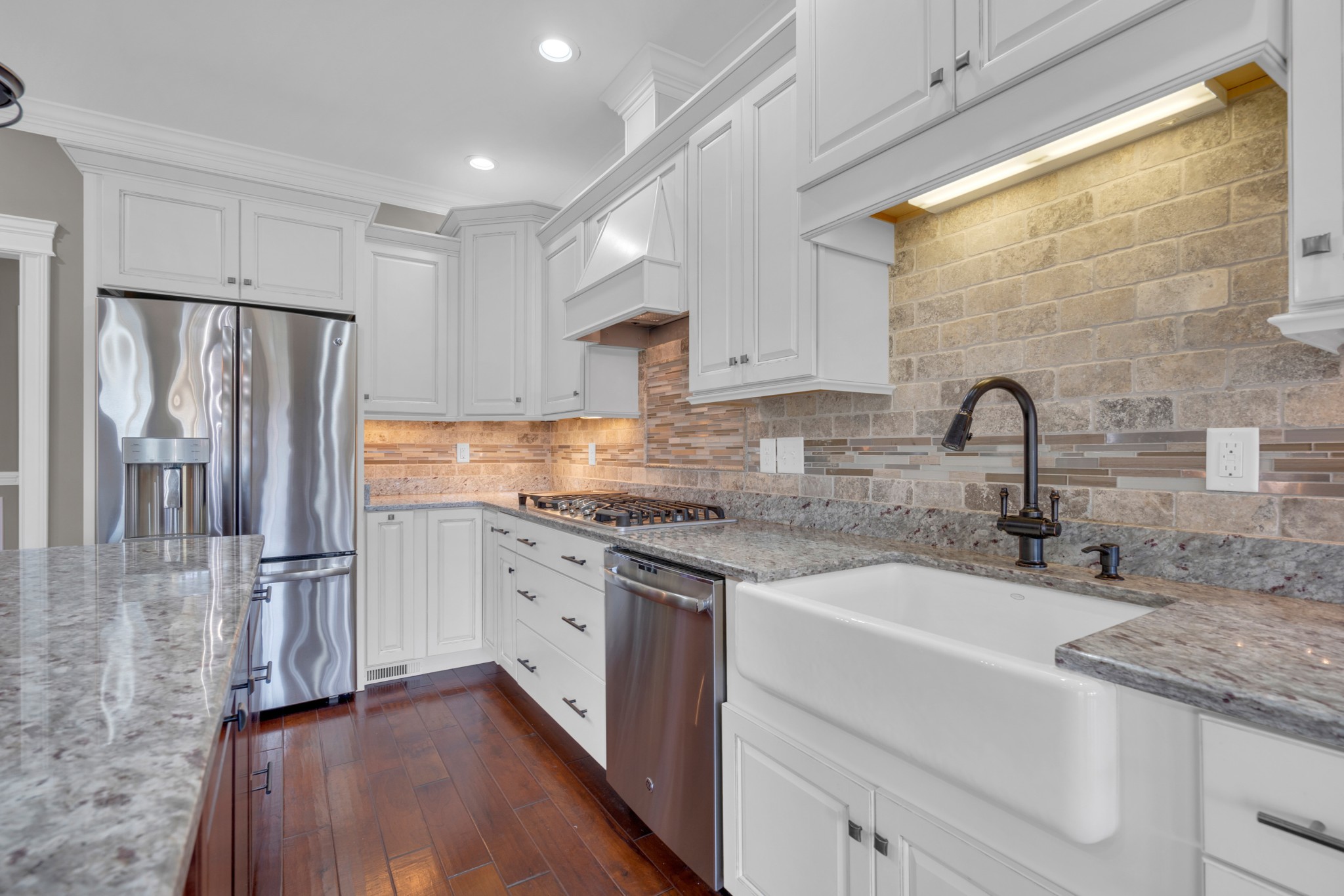 254 Gray Hawk Trail Clarksville, TN 37043 - Photo 6 of 29 a kitchen with stainless steel appliances granite countertop a refrigerator sink and cabinets