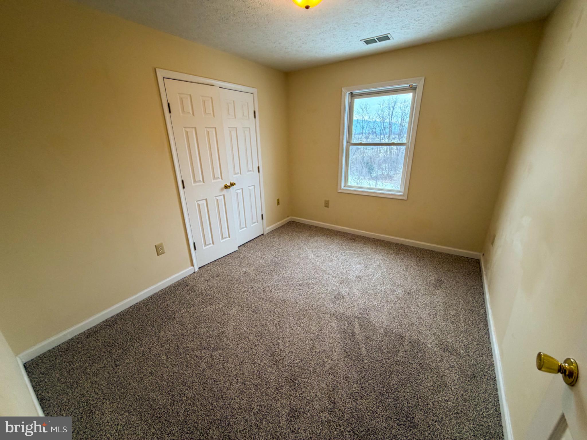1292 South Ox Road, Unit F9 Woodstock, VA 22664 - Photo 11 of 19 Cozy, sunlit room with inviting potential.