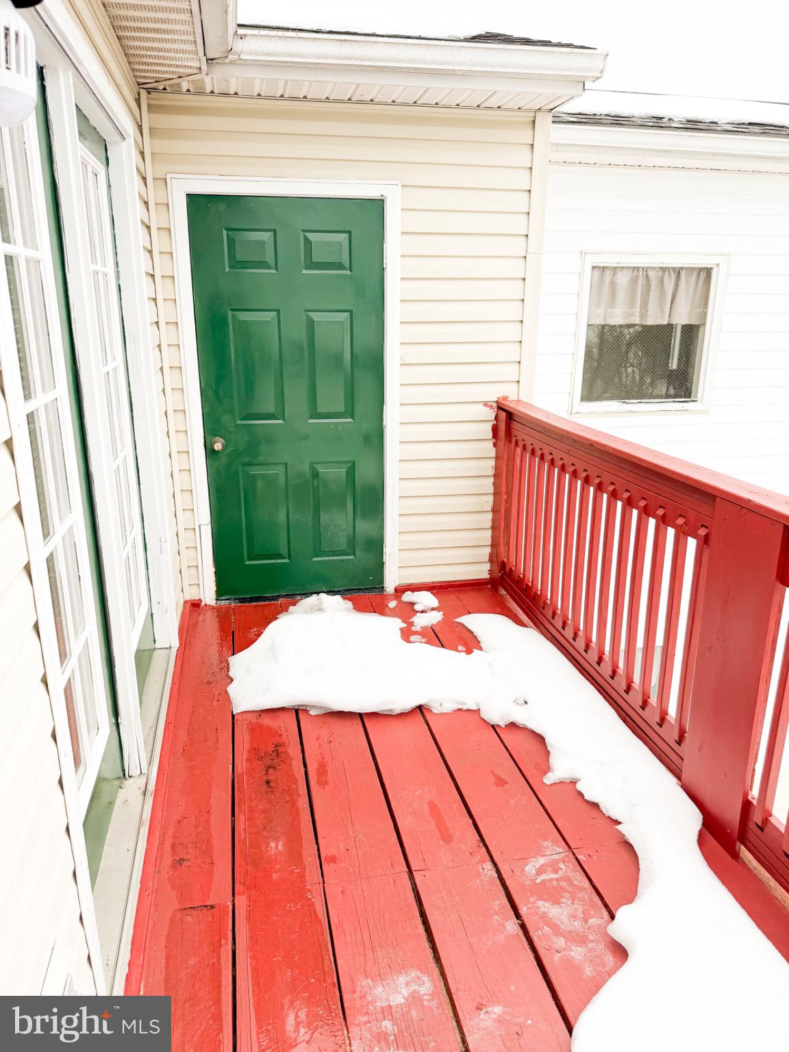 1292 South Ox Road, Unit F9 Woodstock, VA 22664 - Photo 17 of 19 Charming balcony with vibrant colors and snow.