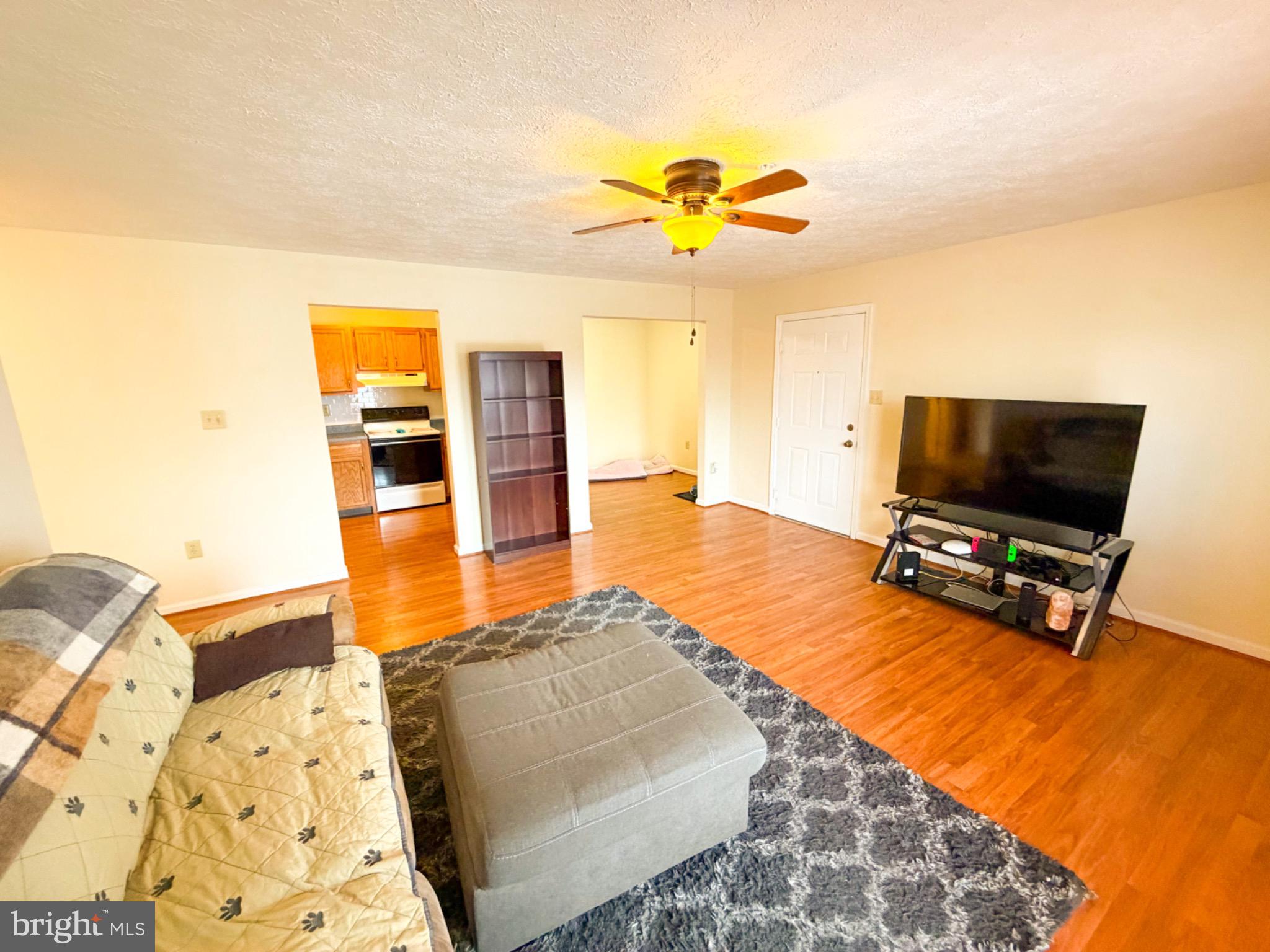 1292 South Ox Road, Unit F9 Woodstock, VA 22664 - Photo 2 of 19 Spacious living area with warm wood floors.