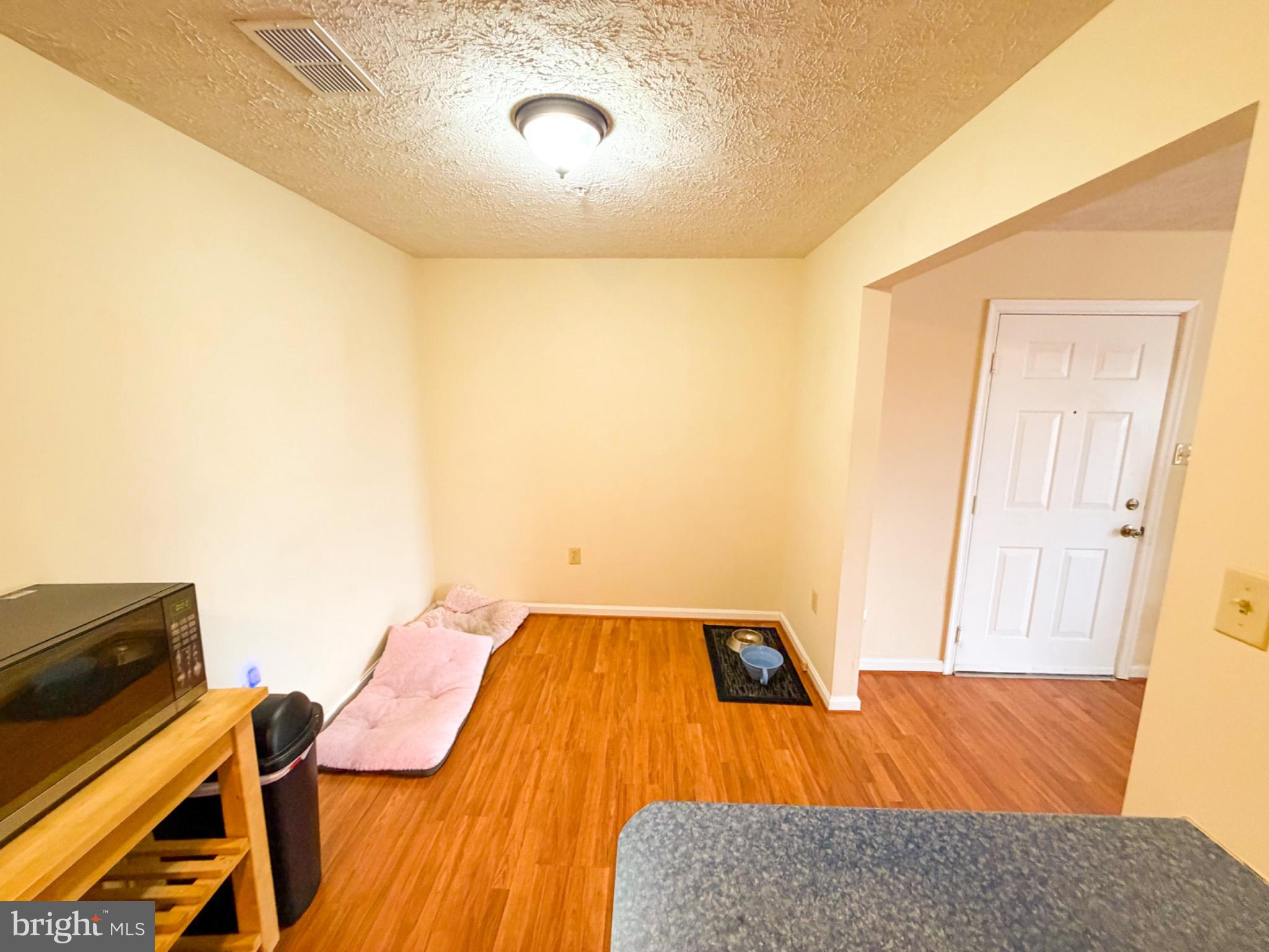 1292 South Ox Road, Unit F9 Woodstock, VA 22664 - Photo 4 of 19 Cozy entryway with warm wood accents.