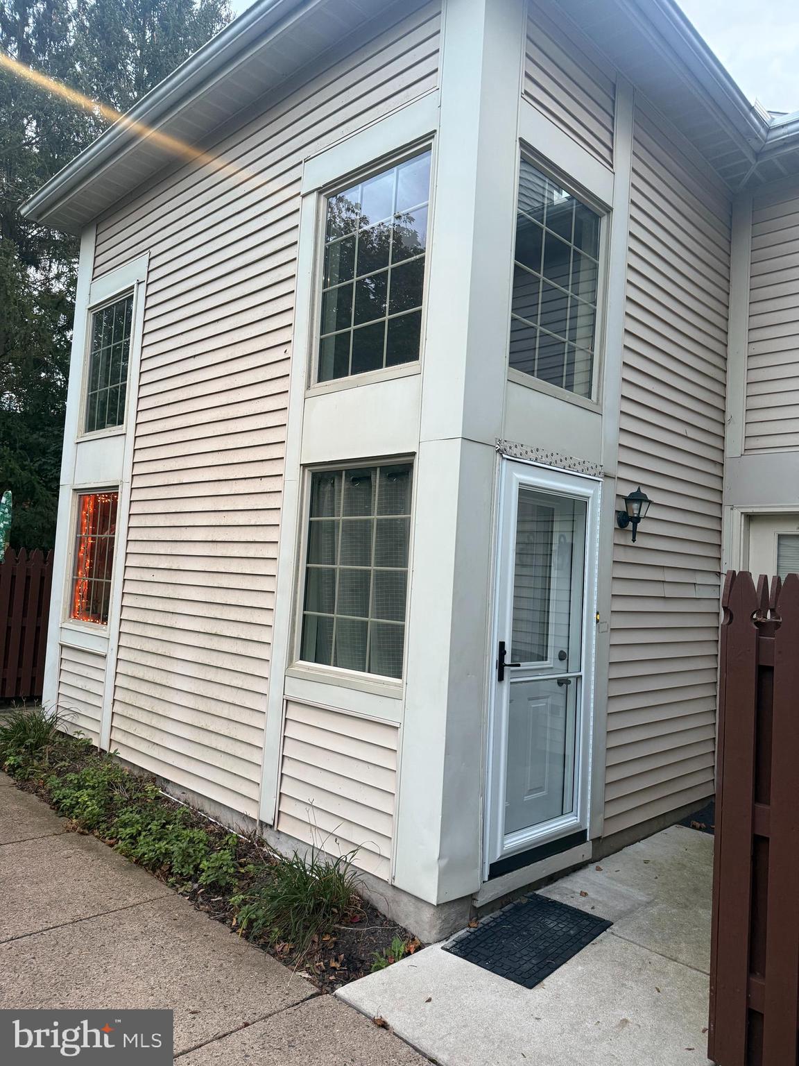 214 Christopher Place, Unit 214 Chalfont, PA 18914 - Photo 1 of 27 a view of a house with white door