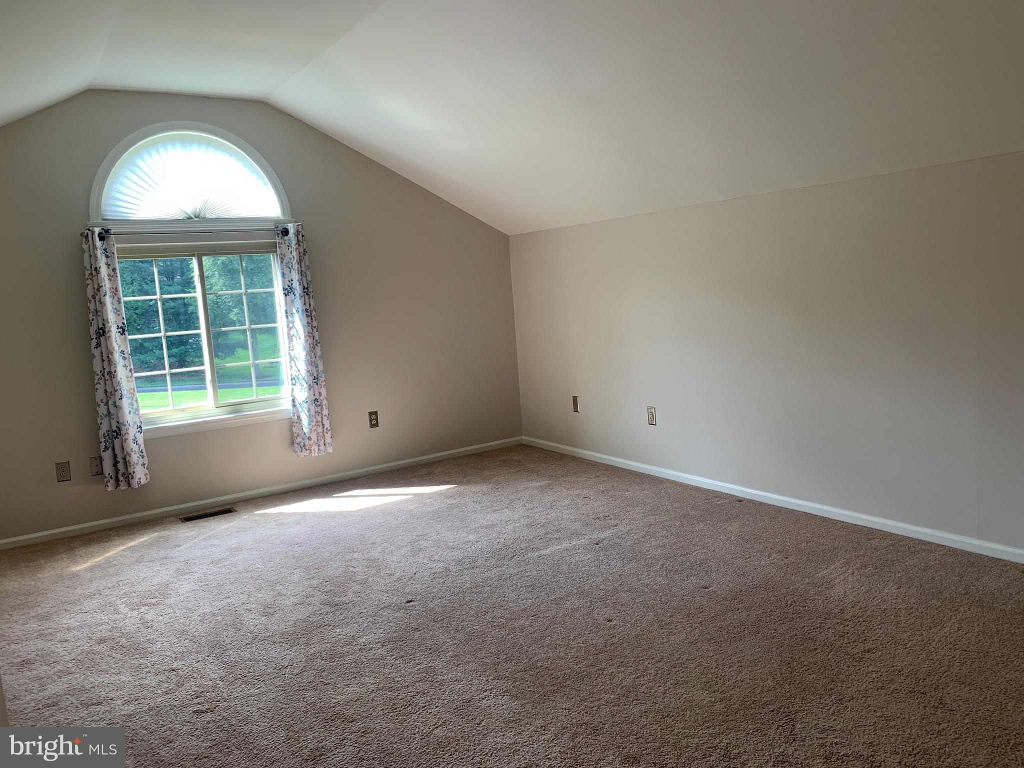 214 Christopher Place, Unit 214 Chalfont, PA 18914 - Photo 24 of 27 an empty room with a window