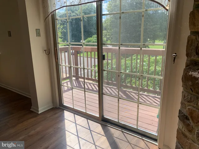 a view of a glass door with a porch
