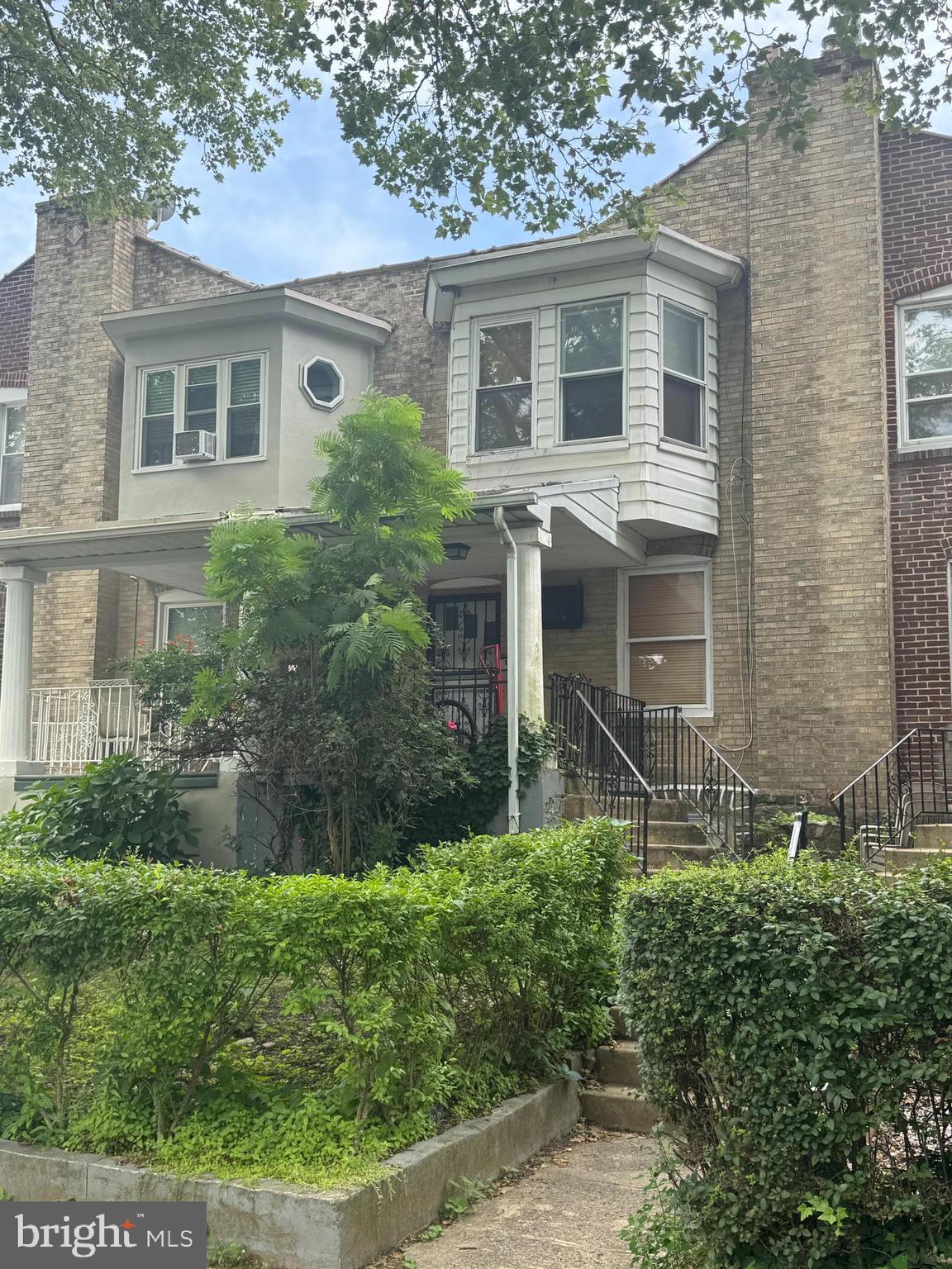 910 Atwood Road Philadelphia, PA 19151 - Photo 2 of 2 front view of a house with a yard