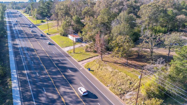 a view of a swimming pool with a yard and seating area