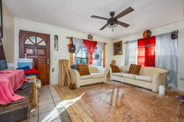 a kitchen with a refrigerator and a dining table