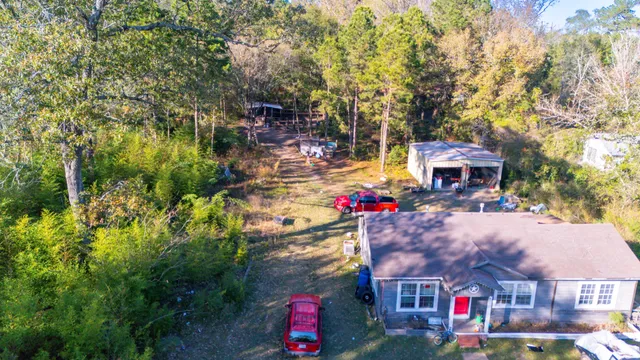 a front view of house with yard and trees