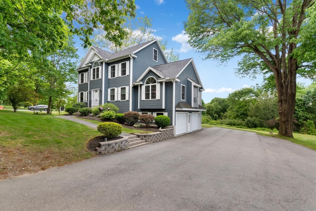 5 Lexington Road Billerica, MA 01821 - Photo 3 of 38 front view of a house with a small yard