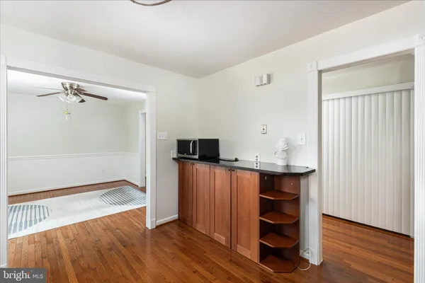 a view of kitchen with cabinets and wooden floor