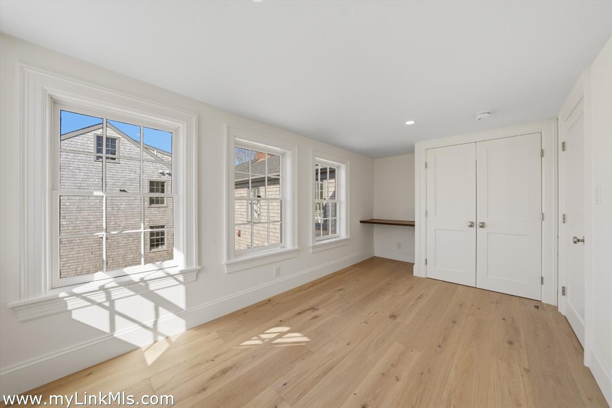 85 Orange Street Nantucket, MA 02554 - Photo 65 of 89 a view of an empty room with glass door