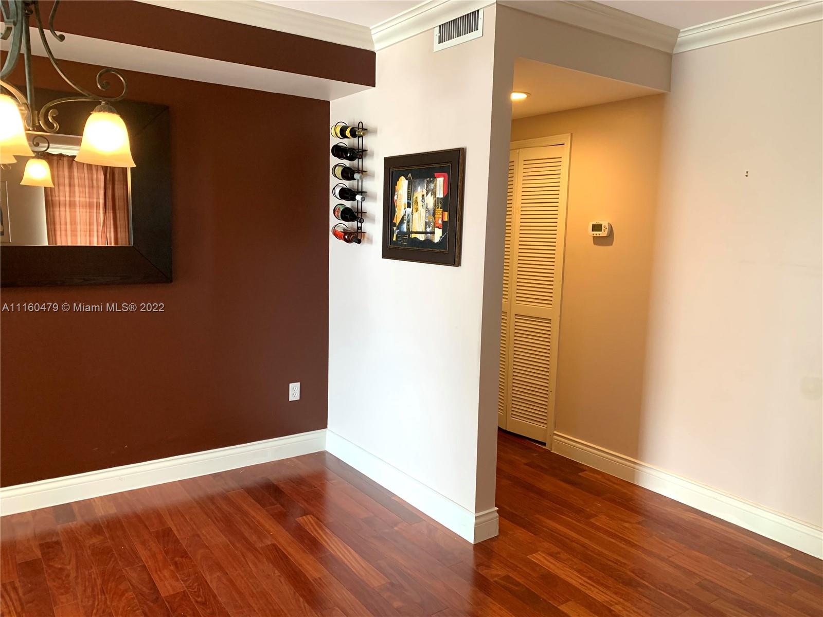 2501 Southwest 37th Avenue, Unit 306 Miami, FL 33133 - Photo 11 of 15 a view of empty room with wooden floor