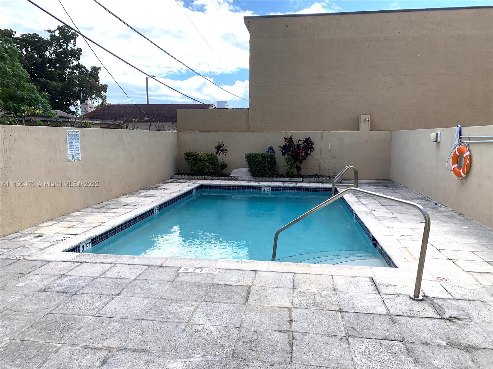 2501 Southwest 37th Avenue, Unit 306 Miami, FL 33133 - Photo 14 of 15 a view of a backyard with seating area