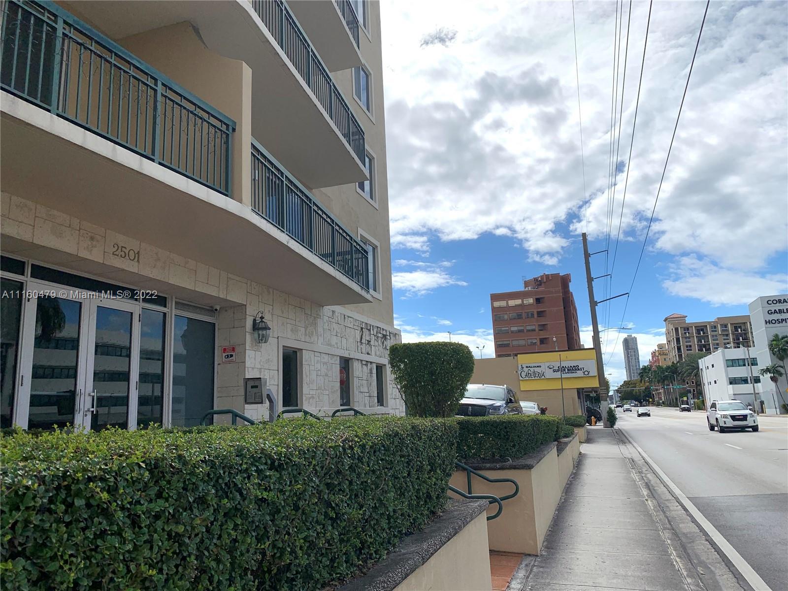 2501 Southwest 37th Avenue, Unit 306 Miami, FL 33133 - Photo 15 of 15 a view of a street with buildings