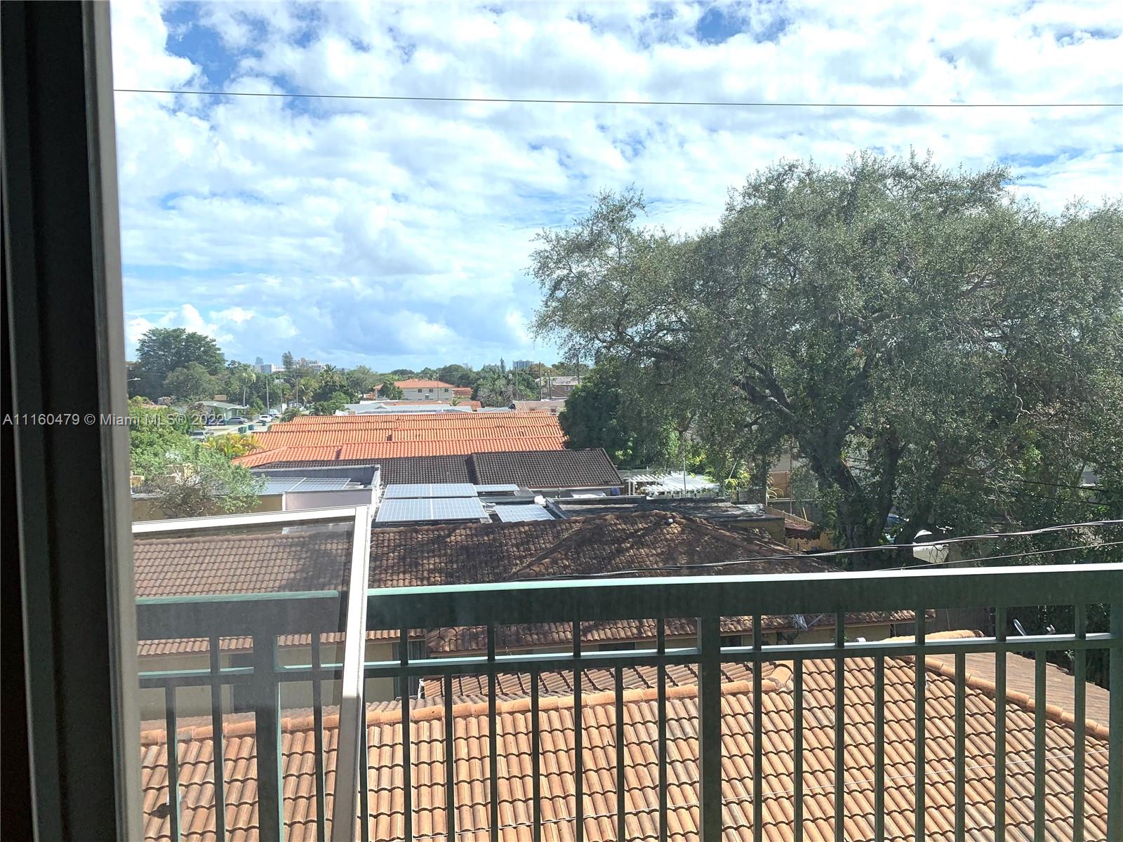 2501 Southwest 37th Avenue, Unit 306 Miami, FL 33133 - Photo 9 of 15 a view of a balcony with an outdoor space