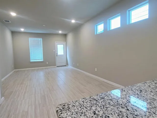 a bathroom with a sink a toilet a mirror and vanity