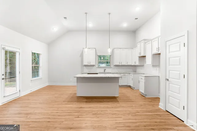 a bathroom with a granite countertop sink and a granite counter tops