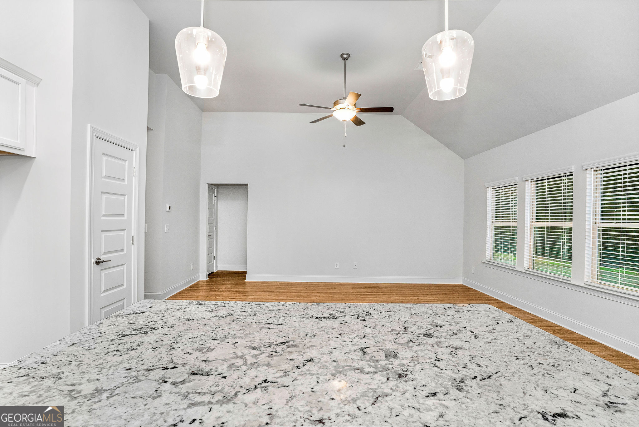 67 Sydney Court, Unit 44 Mansfield, GA 30055 - Photo 16 of 30 an empty room with wooden floor and windows
