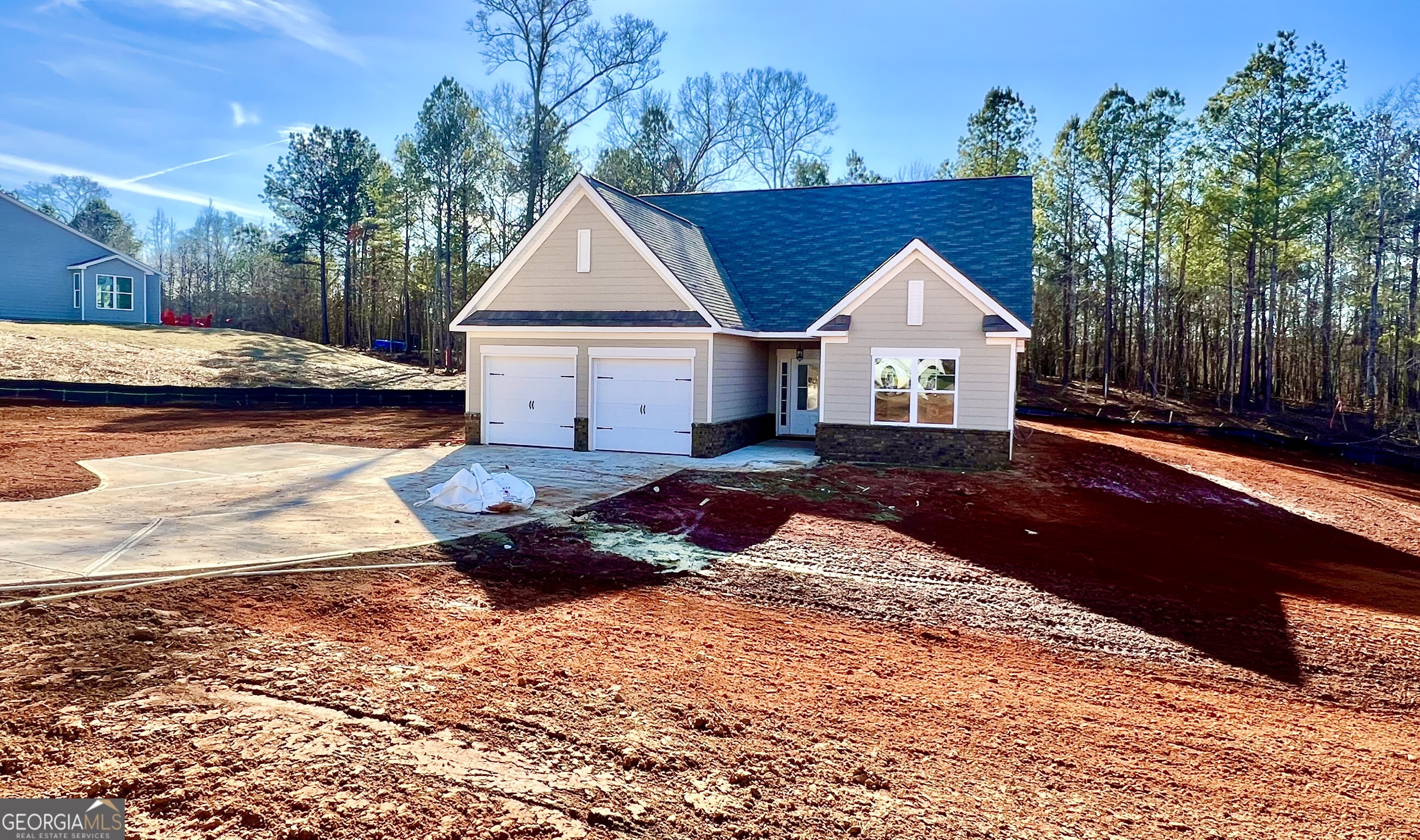 67 Sydney Court, Unit 44 Mansfield, GA 30055 - Photo 2 of 30 a front view of a house with a yard and lake view