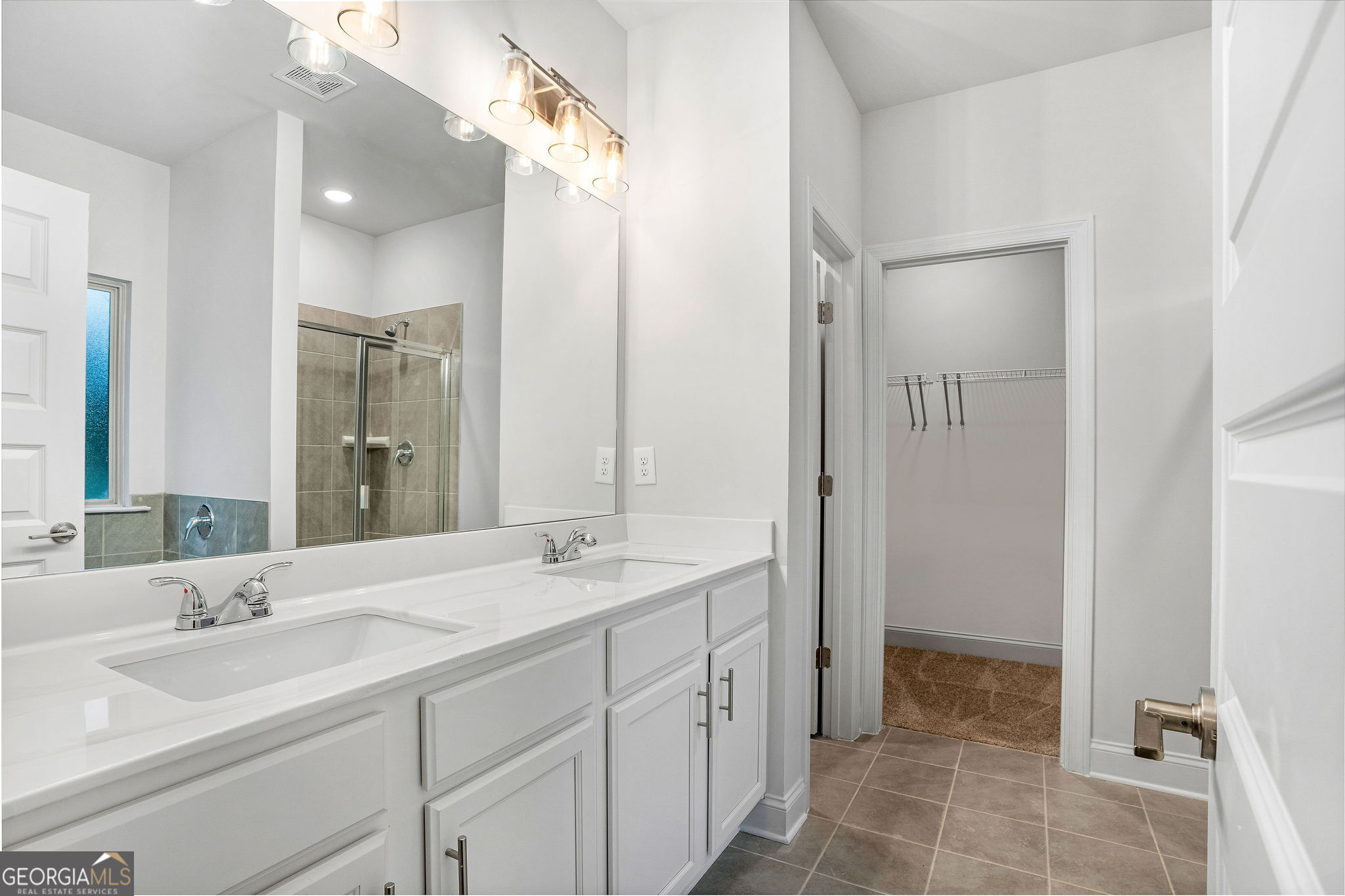 67 Sydney Court, Unit 44 Mansfield, GA 30055 - Photo 22 of 30 a bathroom with a double vanity sink mirror and shower
