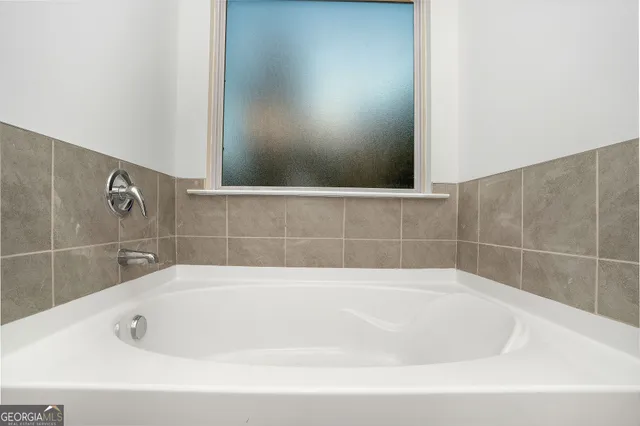 an empty room with closet area