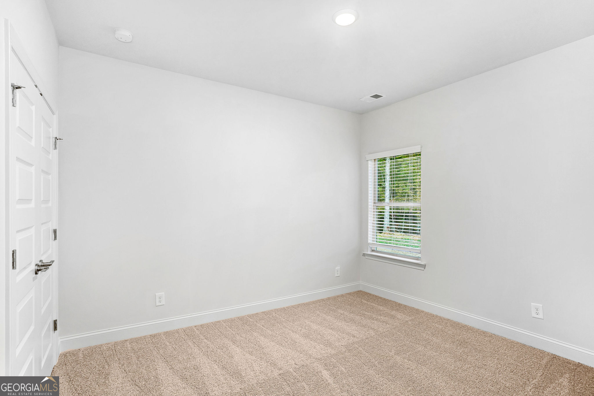 67 Sydney Court, Unit 44 Mansfield, GA 30055 - Photo 26 of 30 an empty room with a window