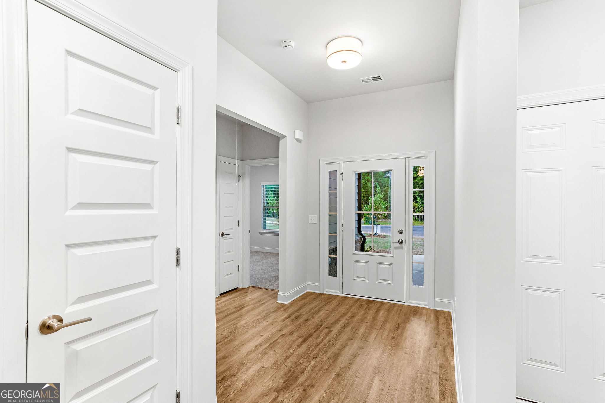 67 Sydney Court, Unit 44 Mansfield, GA 30055 - Photo 6 of 30 a view of walk in closet with empty racks