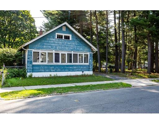 71 Marsden Street Springfield, MA 01109 - Photo 1 of 23 a front view of a house with a yard and garage