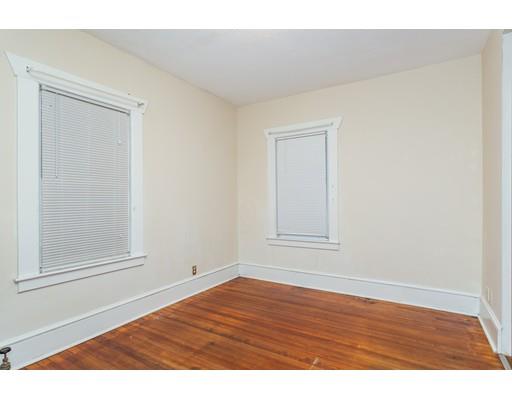 71 Marsden Street Springfield, MA 01109 - Photo 17 of 23 a view of an empty room with wooden floor and a window
