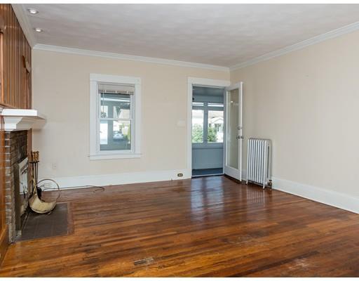 71 Marsden Street Springfield, MA 01109 - Photo 8 of 23 a view of an empty room with window and wooden floor