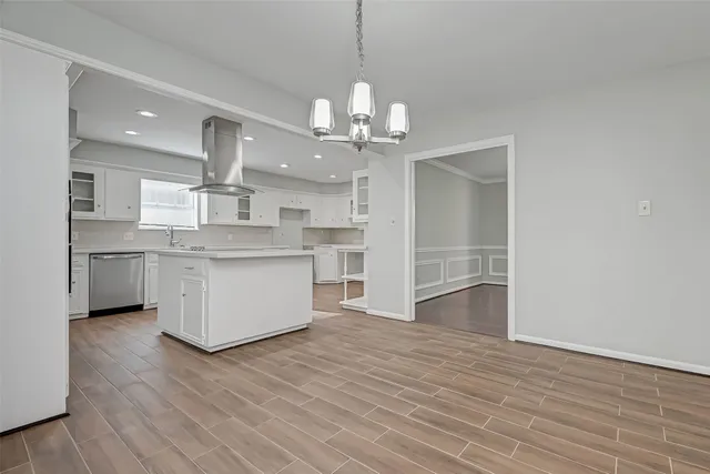 a kitchen with a sink stainless steel appliances and cabinets