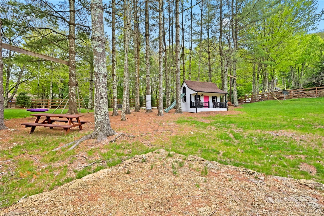 123 St Andrews Road Beech Mountain, NC 28604 - Photo 44 of 50 a view of swimming pool with sitting area and garden
