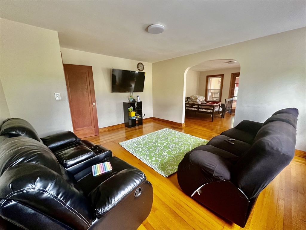 29 Brookfield Road, Unit 1 Sturbridge, MA 01518 - Photo 4 of 9 a living room with furniture and a flat screen tv