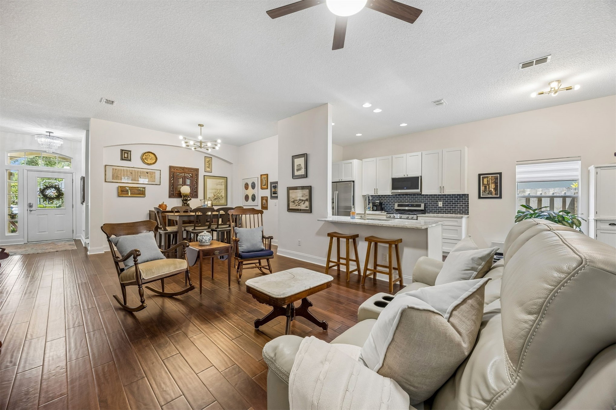 86107 Remsenburg Drive Fernandina Beach, FL 32034 - Photo 6 of 58 a living room with furniture kitchen view and a wooden floor