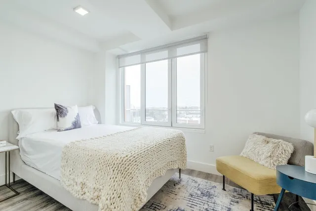 a bedroom with bed and a couch