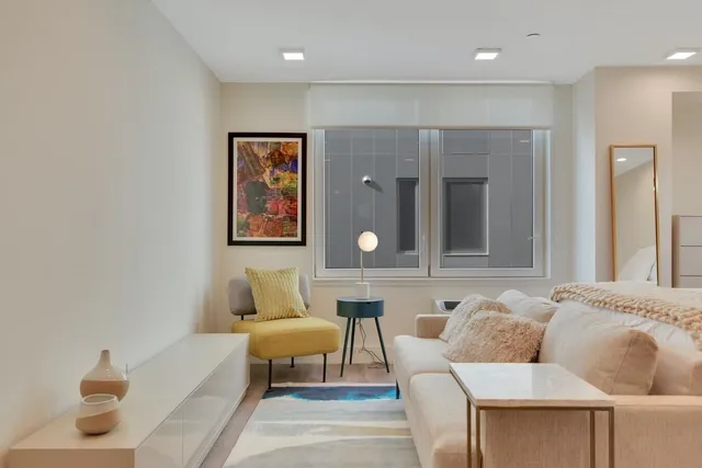 a living room with furniture and window