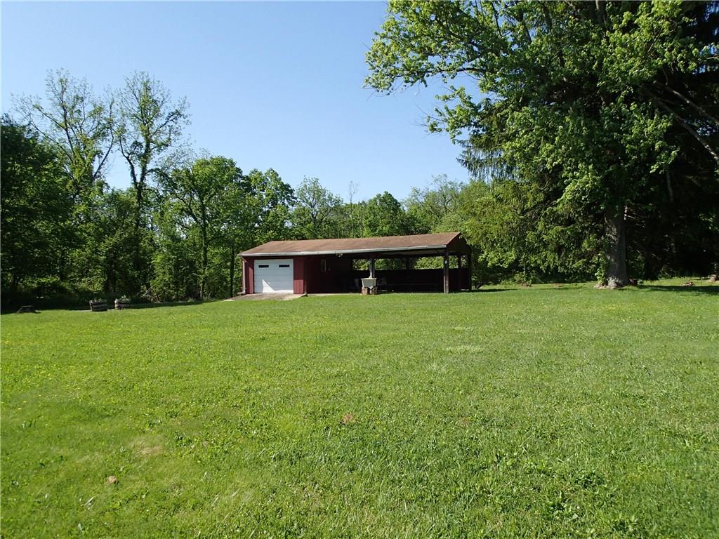1261 Shenango Road Darlington, PA 16115 - Photo 22 of 25 The beautiful flat rear yard with a picnic pavilion and additional storage garage!