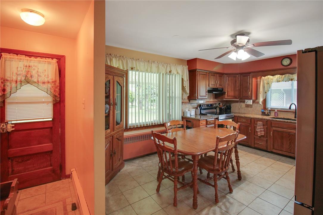 1256 Ridge Avenue Whitehall, PA 18052 - Photo 16 of 43 A well-equipped kitchen features solid wood cabinetry and an inviting dining area.