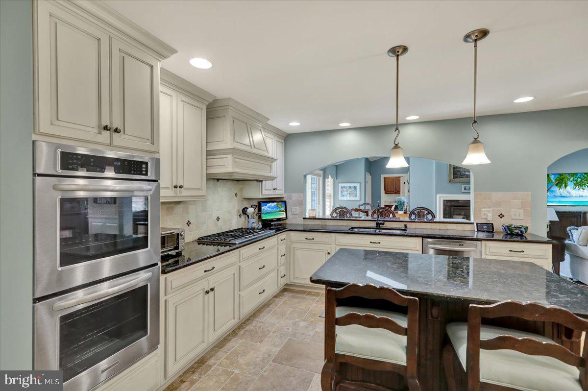 2 Cardinal Road Wyomissing, PA 19610 - Photo 14 of 51 a kitchen with stainless steel appliances granite countertop a sink a stove and cabinets