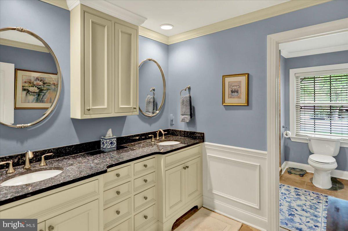 2 Cardinal Road Wyomissing, PA 19610 - Photo 27 of 51 a bathroom with a granite countertop double vanity sink mirror and